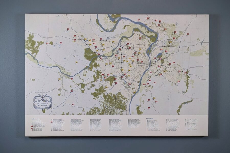Canvas-wrapped St. Louis golf courses map hanging on a wall, marked with red and yellow course flags